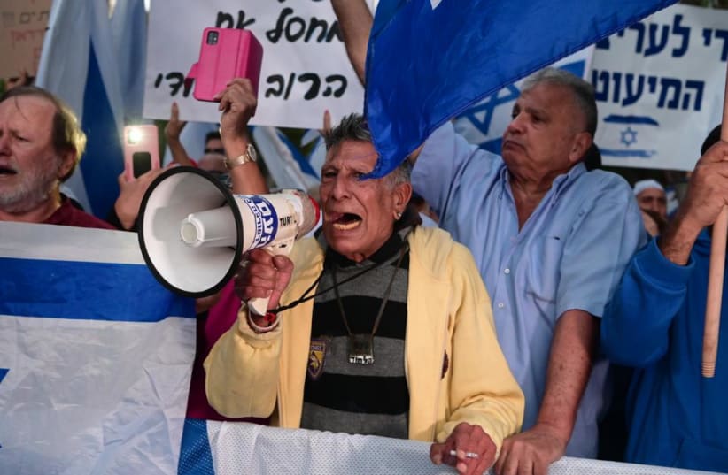  Protesters gather outside the home of Aharon Barak on April 30, 2023.  (photo credit: AVSHALOM SASSONI/MAARIV)