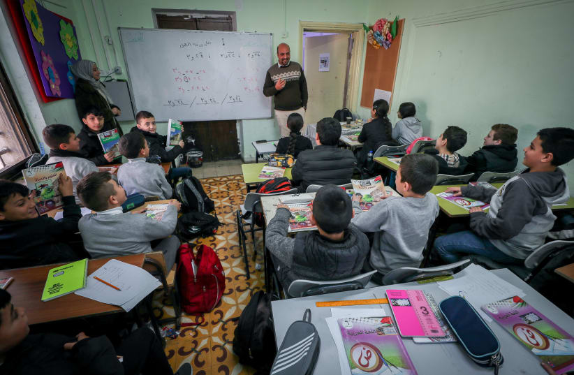  Arab students in the classroom at the Noreen school, in the Jerusalem Arab neighborhood of Beit Hanina, on January 17, 2023. (photo credit: JAMAL AWAD/FLASH90)