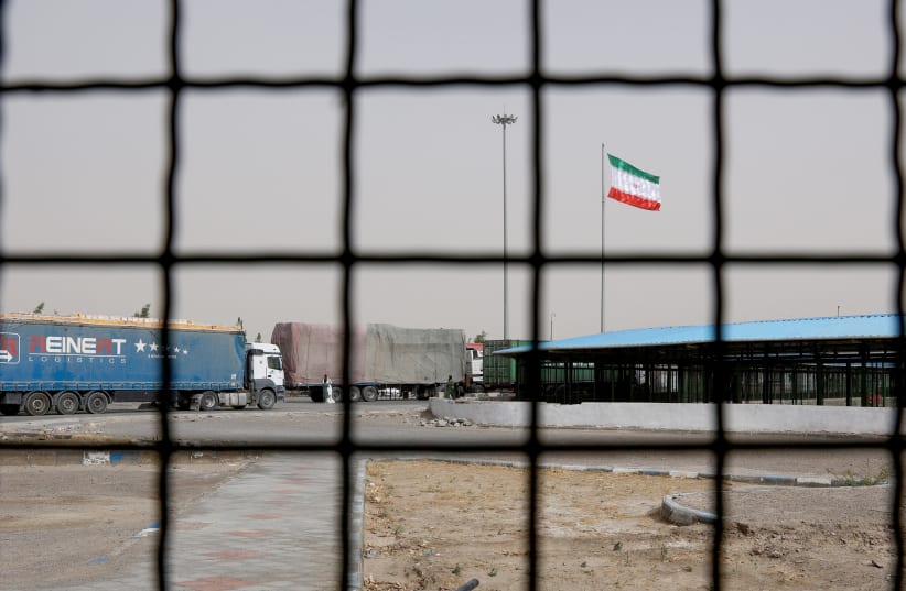  Iran's flag is pictured at the Milak border crossing between Iran and Afghanistan, Sistan and Baluchestan Province, Iran September 8, 2021.  (photo credit: Majid Asgaripour/WANA via Reuters)