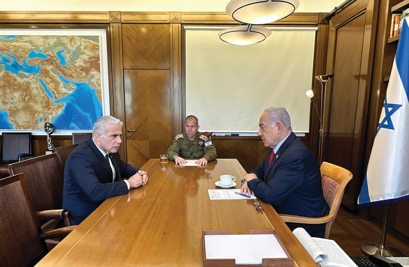  PRIME MINISTER Benjamin Netanyahu meets with opposition leader Yair Lapid at the Prime Minister’s Office in Jerusalem on Wednesday, to update him on Operation Shield and Arrow. The PM’s Military Secretary, Maj.-Gen. Avi Gil, also attended the meeting. (photo credit: GPO)