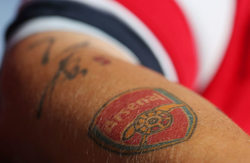 Football - Leicester City v Arsenal - Barclays Premier League - King Power Stadium - 31/8/14 An Arsenal fan wih a tattoo of their emblem (photo credit: Action Images / Carl Recine Livepic)