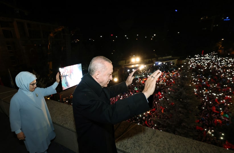  Turkish President Tayyip Erdogan, accompanied by his wife Emine Erdogan, greets his supporters at the AK Party headquarters in Ankara, Turkey May 15, 2023.  (photo credit: PRESIDENTiAL PRESS OFFICE/REUTERS)