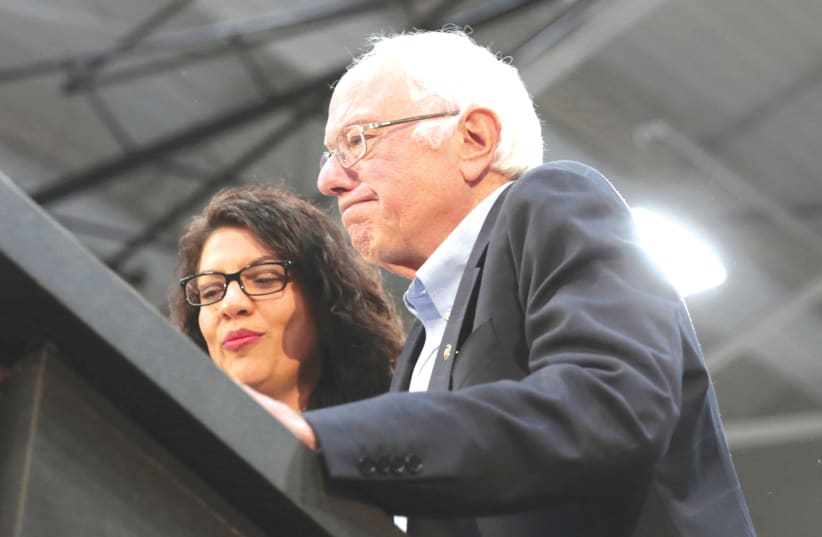  SEN. BERNIE SANDERS and Rep. Rashida Tlaib address a Sanders presidential campaign rally in Detroit in 2019. Last week, Sanders allowed Tlaib to host a ‘Nakba’ event on Capitol Hill (photo credit: REBECCA COOK/REUTERS)