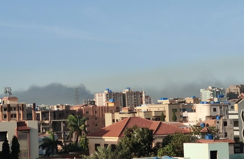  A general view shows a cloud of smoke in Khartoum, Sudan, April 18, 2023 in this screen grab obtained from a social media video. (photo credit: Twitter @ayman_amin_/via REUTERS )