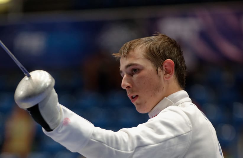  Israel's Yuval Shalom Freilich salutes during his bout against Ivan Trevejo from France in the table of 64 of the men's épée event in the 2013 World Fencing Championships 2013 at Syma Hall in Budapest, 8 August 2013. (photo credit: MARIE-LAN NGUYEN / WIKIMEDIA COMMONS)