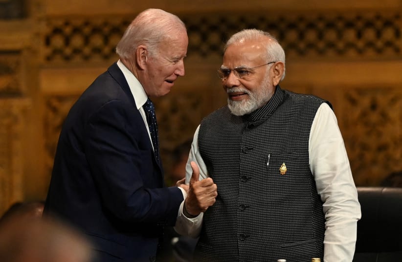 President of the U.S. Joe Biden speaks with Prime Minister of India Narendra Modi at the G20 Summit opening session in Nusa Dua, Bali, Indonesia, Tuesday, Nov. 15, 2022 (photo credit: PRASETYO UTOMO/G20 Media Center/Handout via REUTERS THIS IMAGE HAS BEEN SUPPLIED BY A THIRD PARTY)