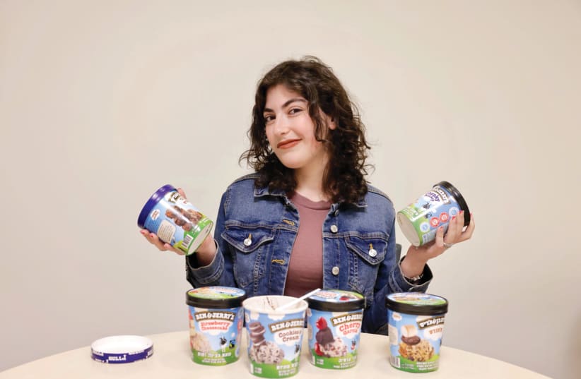  IT’S ALL about the dairy on Shavuot. Desk manager Ariella Marsden holds pints of Ben & Jerry's ice cream (photo credit: MARC ISRAEL SELLEM)