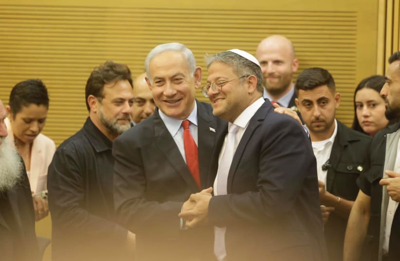  Prime Minister Benjamin Netanyahu and National Security Minister Itamar Ben-Gvir embrace ahead of the 2023 budget vote. (photo credit: MARC ISRAEL SELLEM)