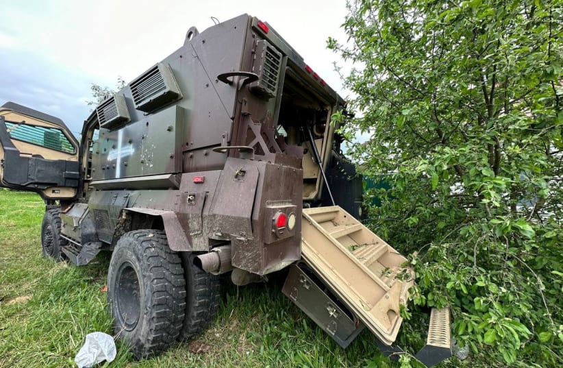  A view shows an abandoned armoured vehicle, after anti-terrorism measures introduced for the reason of a cross-border incursion from Ukraine were lifted, in what was said to be a settlement in the Belgorod region, in this handout image released May 23, 2023. (photo credit: Governor of Russia's Belgorod Region Vyacheslav Gladkov via Telegram/Handout via REUTERS)