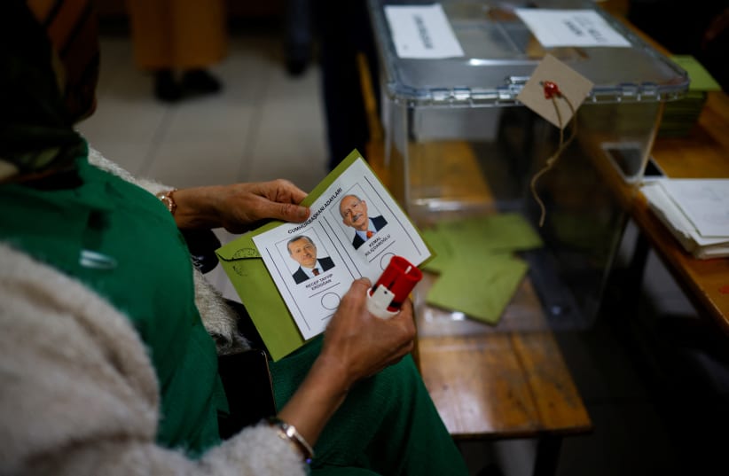  A person holds a ballot during the second round of the presidential election in Istanbul, Turkey May 28, 2023. (photo credit: REUTERS/KEMAL ASLAN)