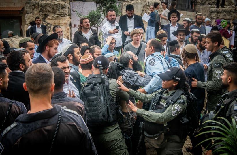  Jewish activists clash with police during a protest against a conference of Christians outside the Davidson Center in Jerusalem Old City, on May 28, 2023.  (photo credit: ARIE LEIB ABRAMS/FLASH 90)
