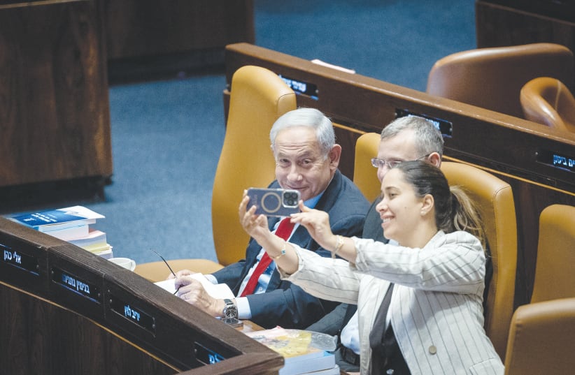  WOMEN’S ADVANCEMENT Minister May Golan takes a selfie with Prime Minister Benjamin Netanyahu and Justice Minister Yariv Levin in the Knesset, last week. Elections are not likely anytime soon, says the writer.  (photo credit: YONATAN SINDEL/FLASH90)