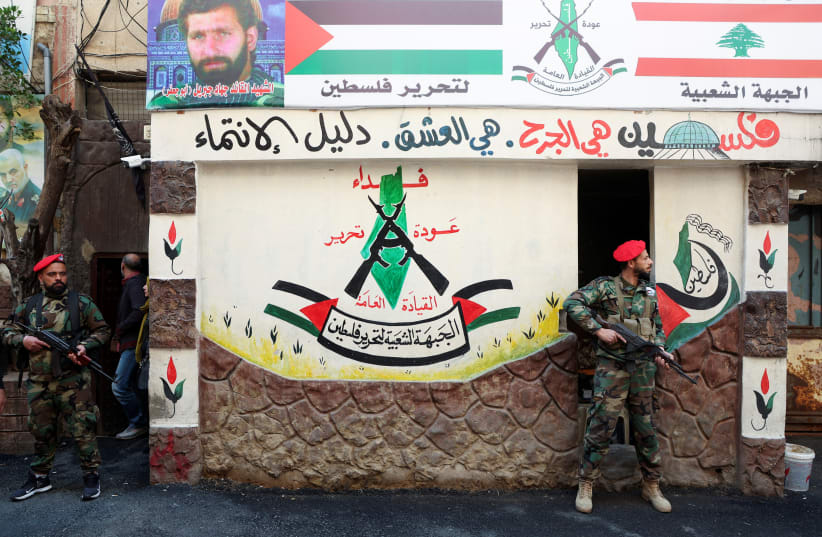  Members of the Popular Front for the Liberation of Palestine-General Command (PFLP-GC) stand guard during a parade marking the annual al-Quds Day, (Jerusalem Day), at Burj al-Barajneh Palestinian refugee camp in Beirut, Lebanon April 14, 2023. (photo credit: REUTERS/MOHAMED AZAKIR)