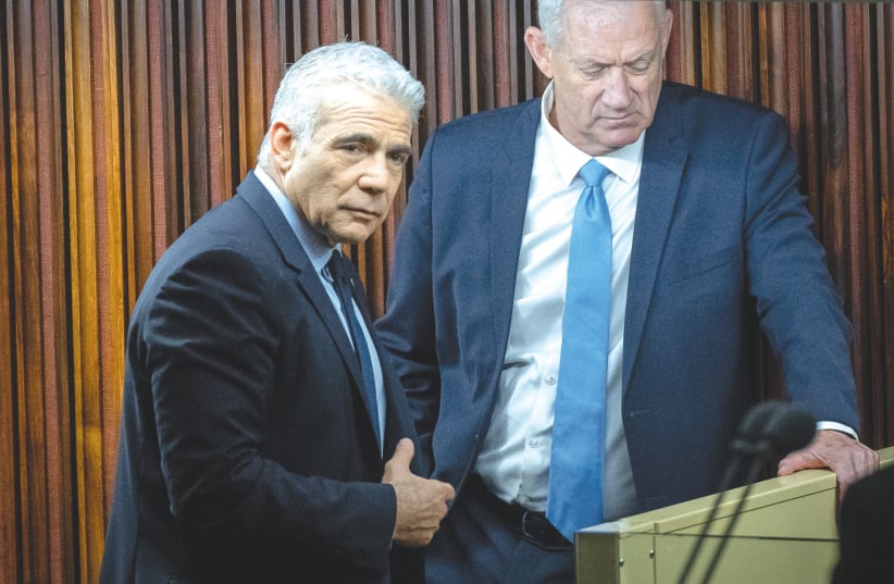  YESH ATID head MK Yair Lapid and National Unity head MK Benny Gantz seen in happier times and last month, in the Knesset.  (photo credit: YONATAN SINDEL/FLASH90)