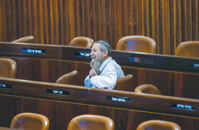 MK AVI Maoz sits among empty seats in the Knesset plenum. (photo credit: OLIVIER FITOUSSI/FLASH90)
