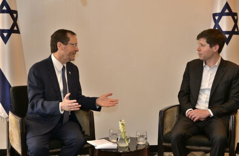  President Herzog (left) speaks with OpenAI CEO Sam Altman (right). (photo credit: AMOS BEN-GERSHOM/GPO)