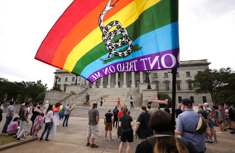 Supporters of the LGBTQIA+ community gathered for the Don't Drag Us Down protest at the State House in Columbia, South Carolina, U.S. May 5, 2023. (photo credit: REUTERS/SAM WOLFE)