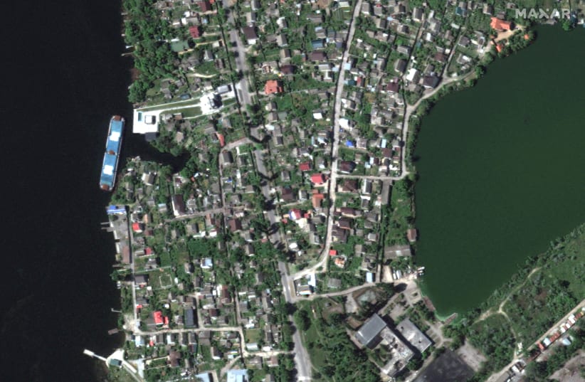 A satellite image shows a view before homes were flooded along Dnipro River southeast of Kherson, Ukraine, in this picture obtained by Reuters on June 6, 2023. (photo credit: MAXAR TECHNOLOGY/HANDOUT VIA REUTERS)