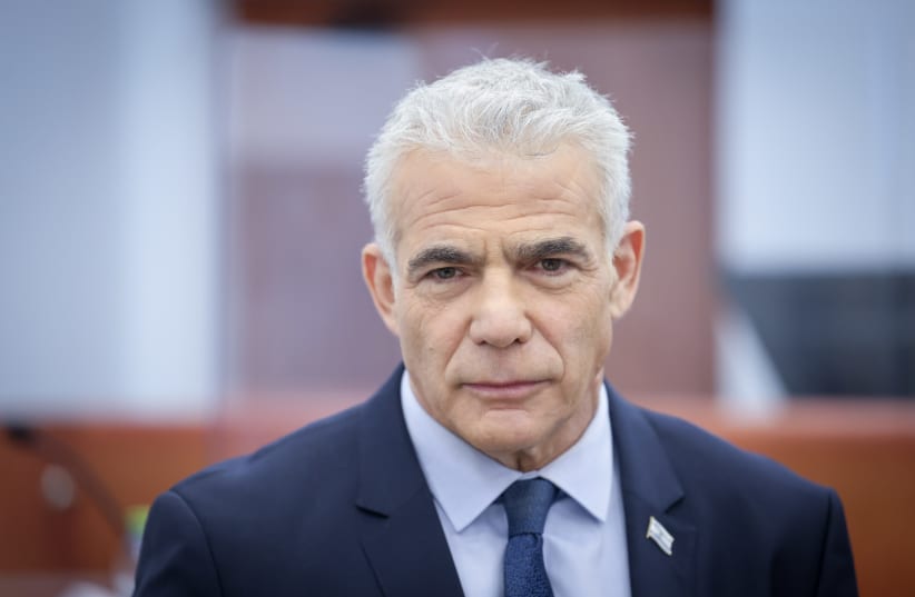  Head of opposition Yair Lapid arrives to testify in the trial against Israeli prime minister Benjamin Netanyahu at the District Court in Jerusalem on June 13, 2023. (photo credit: YONATAN SINDEL/FLASH90)
