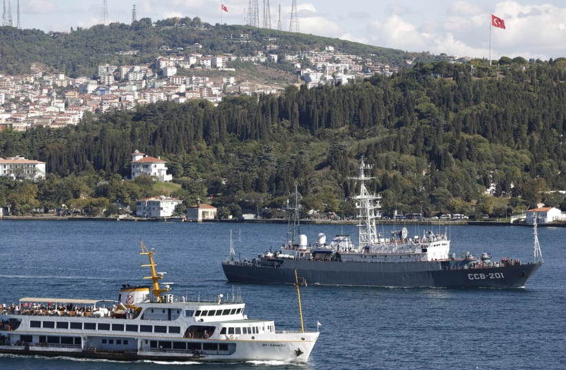 Russian Black Sea Fleet Intelligence vessel SSV-201 Priazovye (R) crosses the Bosphorus on its way to the Mediterranean sea, in Istanbul September 5, 2013. (photo credit: MURAD SEZER/REUTERS)