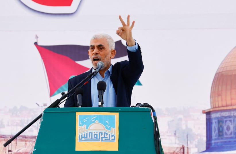  Yaya Sinwar, Gaza Strip chief of the Palestinian Islamist Hamas movement, speaks during a rally to mark the annual al-Quds Day (Jerusalem Day), in Gaza, April 14, 2023 (photo credit: REUTERS/IBRAHEEM ABU MUSTAFA)