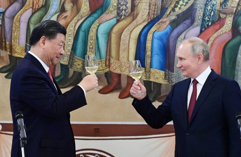  Russian President Vladimir Putin and Chinese President Xi Jinping attend a reception at the Kremlin in Moscow, Russia March 21, 2023.  (photo credit: Sputnik/Pavel Byrkin/Kremlin via REUTERS)
