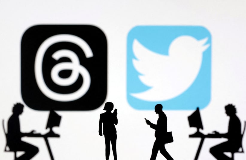 Meta Threads and Twitter app logos are seen in this illustration taken, July 6, 2023. (photo credit: REUTERS/DADO RUVIC/ILLUSTRATION/FILE PHOTO)