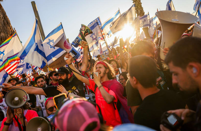  Anti-judicial overhaul demonstrators protest against the Israeli government's judicial overhaul, outside the U.S. Embassy Branch Office in Tel Aviv, July 11, 2023. (photo credit: Chaim Goldberg/Flash90)