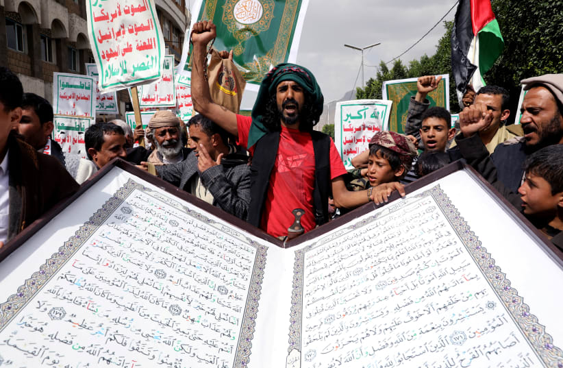  People rally to denounce the burning of the Koran in Sweden and the Israeli military operation in the West Bank city of Jenin, in Sanaa, Yemen July 4, 2023.  (photo credit: REUTERS/Khaled Abdullah TPX IMAGES OF THE DAY)