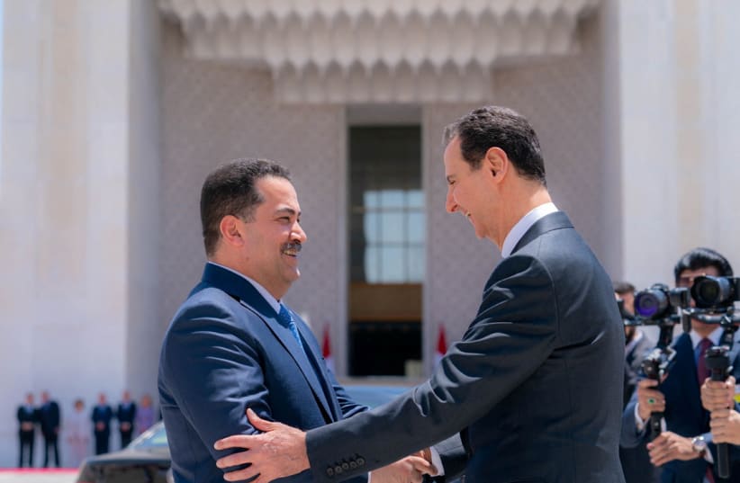  Syria's President Bashar al-Assad greets Iraqi Prime Minister Mohammed Shia Al-Sudani in Damascus, Syria July 16, 2023. (photo credit: SANA/HANDOUT VIA REUTERS)