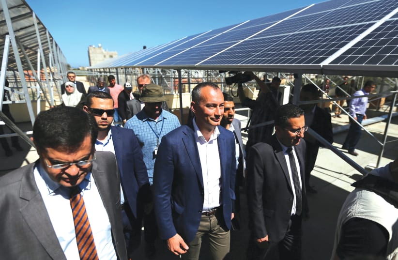  NICKOLAY MLADENOV, the UN special coordinator for the Middle East peace process, visits a solar energy project at Nasser Hospital in the southern Gaza Strip, in 2019. (photo credit: IBRAHEEM ABU MUSTAFA/REUTERS)