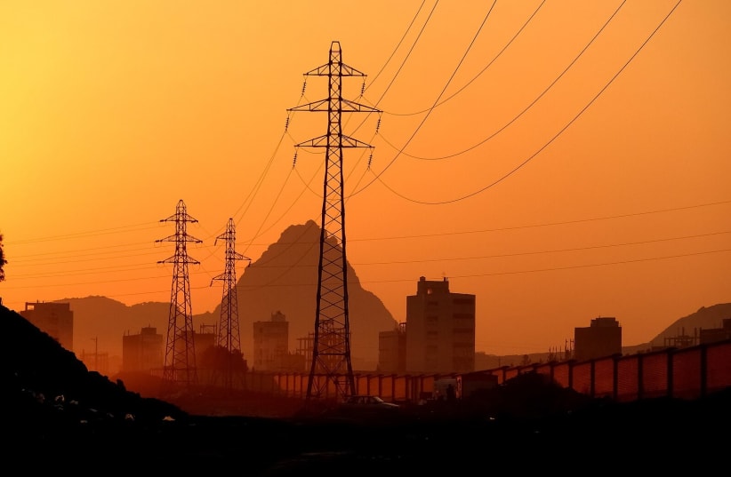  Overhead power lines in Qom City, Iran (photo credit: Wikimedia Commons)