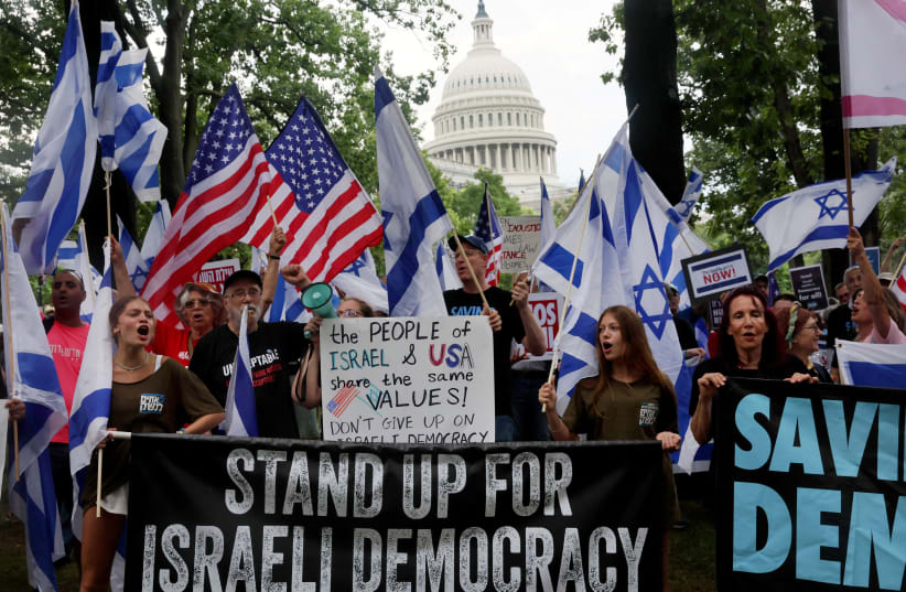  People rally for democracy in Israel before Israeli President Isaac Herzog is scheduled to address congress at the US Capitol building in Washington, US, July 19, 2023 (photo credit: LEAH MILLIS/REUTERS)