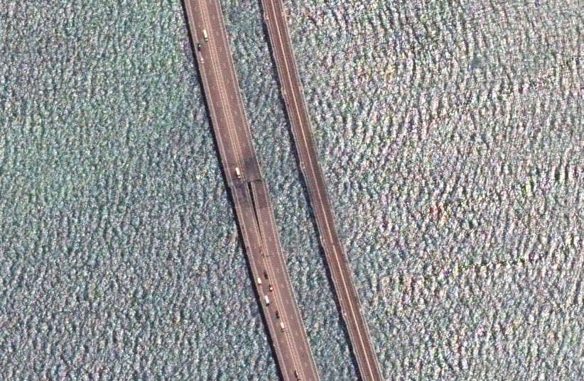 A satellite image shows a rotated and close up view of the damaged span of the Crimea bridge in Kerch Strait, July 17,2023. (photo credit: MAXAR TECHNOLOGY/HANDOUT VIA REUTERS)