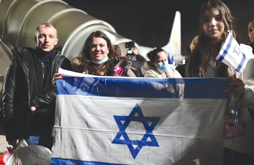  JEWISH IMMIGRANTS fleeing the war in Ukraine arrive in Israel last year on a rescue flight sponsored by Keren Hayesod. (photo credit: TOMER NEUBERG/FLASH90)