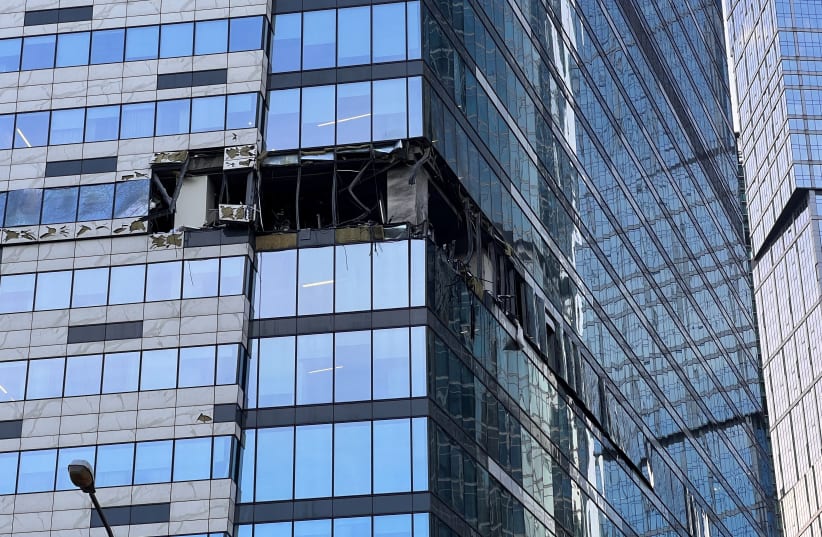  A view shows the damaged facade of an office building in the Moscow City following a reported Ukrainian drone attack in Moscow, Russia, July 30, 2023 (photo credit:  REUTERS/STAFF)