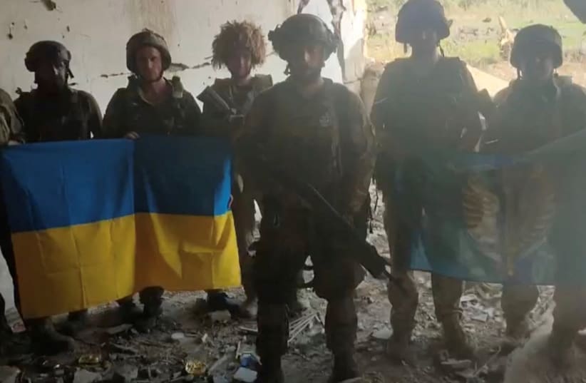  Ukrainian soldiers say they have recaptured the Ukrainian village of Staromaiorske, in Donetsk region, Ukraine, in this screen grab from video posted by Ukrainian President Volodymyr Zelensky and released on July 27, 2023. (photo credit: Telegram/V_Zelenskiy_official/via REUTERS)