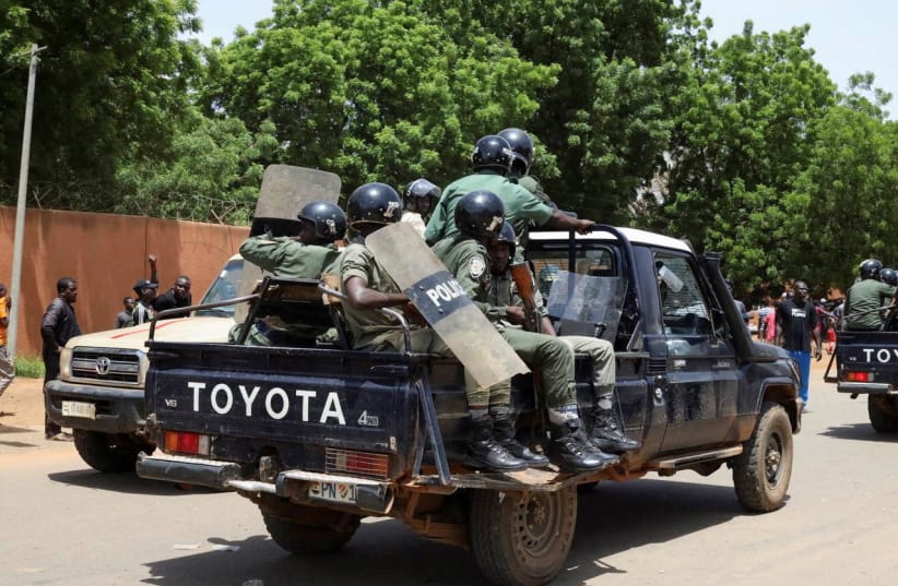  Nigerien security forces prepare to disperse pro-junta demonstrators gathered outside the French embassy, in Niamey, the capital city of Niger July 30, 2023.  (photo credit:  REUTERS/Souleymane Ag Anara)