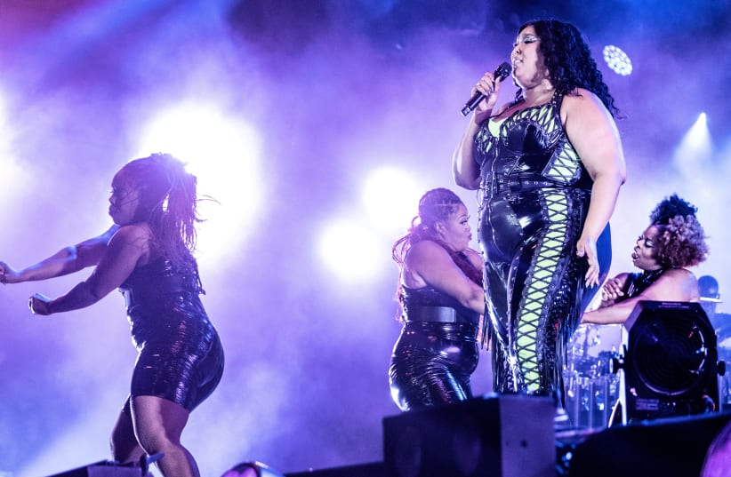 PREVIEW  XML FILE PHOTO: Lizzo plays at Orange Stage at the Roskilde festival, in Roskilde , Denmark on Saturday July 1. 2023. (photo credit: REUTERS)