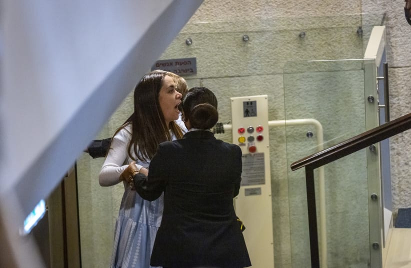  Israeli lawmaker May Golan is taken out during a plenum session in the assembly hall of the Israeli parliament, on July 12, 2021. (photo credit: OLIVIER FITOUSSI/FLASH90)