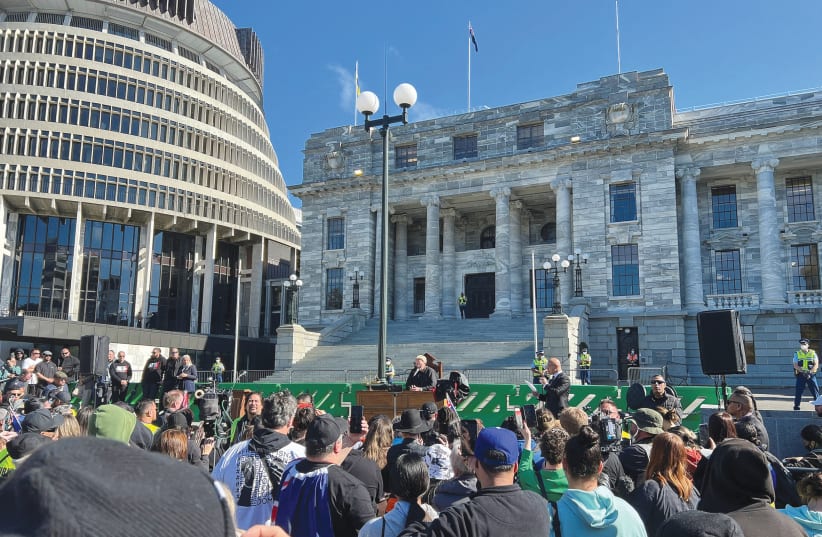  DEMONSTRATORS GATHER on the grounds of New Zealand Parliament in Wellington last year to protest what they consider government encroachment on freedoms. (photo credit: Lucy Craymer/Reuters)