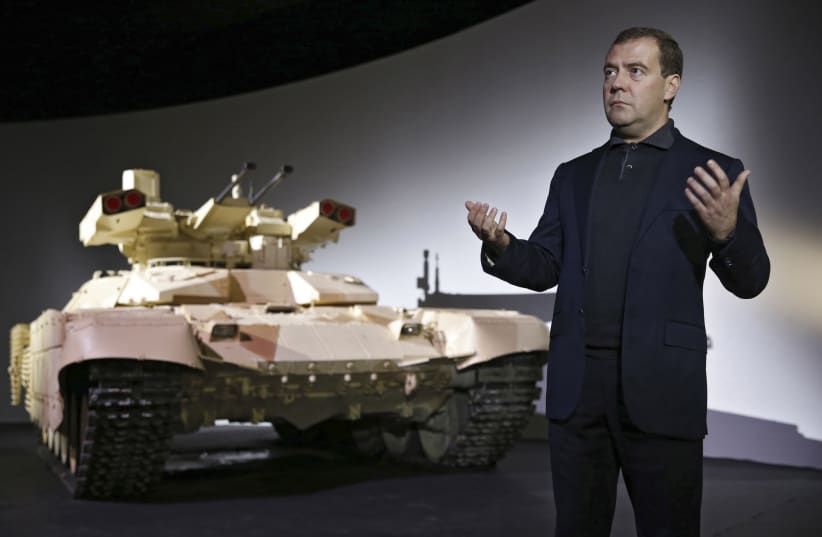  Russia's Dmitry Medvedev speaks during a presentation of the BMPT-72 tank, dubbed the "Terminator-2" (photo credit: REUTERS)