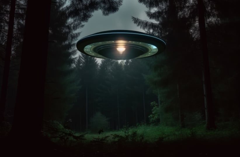  An alien UFO hovers in the middle of a forest.  (photo credit: INGIMAGE)