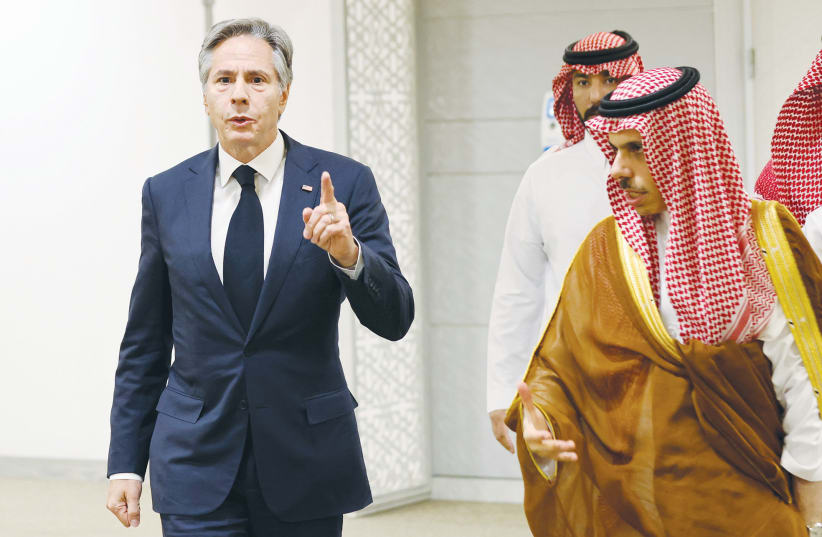  US SECRETARY of State Antony Blinken walks with Saudi Arabia’s Foreign Minister Prince Faisal bin Farhan during a visit to Riyadh, in June.  (photo credit: Ahmed Yosri/Reuters)