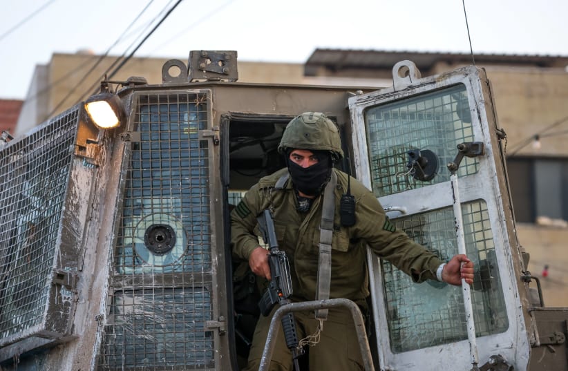  Israeli security forces secure the scene of a shooting attack in Huwara, in the West Bank, near Nablus, August 19, 2023. (photo credit: FLASH90)