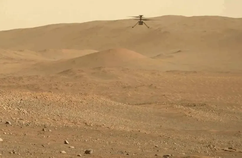  NASA's Perseverance rover filmed the Ingenuity helicopter during its 54th flight. (photo credit: NASA/JPL-Caltech/ASU/MSSS)
