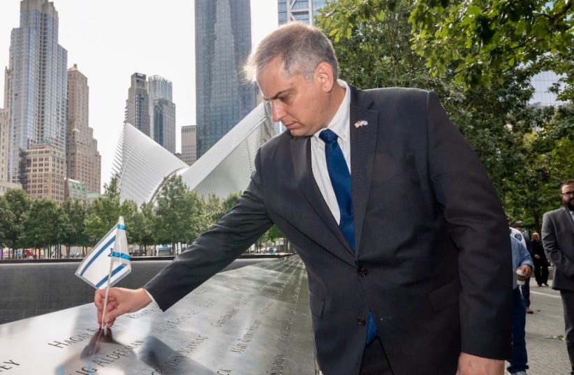  Israel Nitzan, Israel's acting consul general in New York, places an Israeli flag in memory of the victims of the Sept. 11 terrorist attacks, in a ceremony marking the tragedy's 20th anniversary on the Hebrew calendar, Aug. 31, 2021. (photo credit: @ISRAELINNEWYORK)
