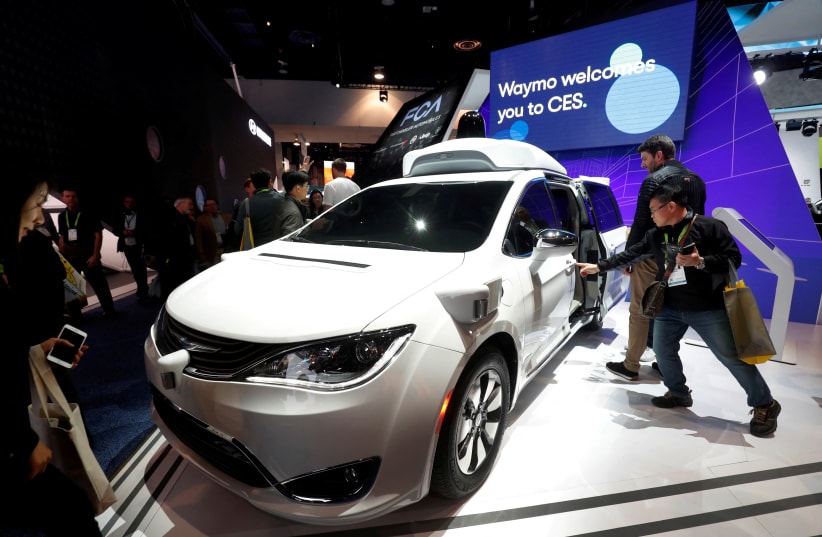 A Waymo autonomous vehicle (formerly the Google self-driving car project) is displayed at the Fiat Chrysler Automobiles booth during the 2019 CES in Las Vegas, Nevada, U.S. January 8, 2019. (photo credit: STEVE MARCUS/REUTERS)