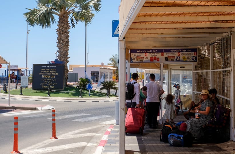  People cross to Egypt through the Taba Border Crossing, during the summer holiday, in the southern Israeli city of Eilat, August 6, 2023 (photo credit: NOAM REVKIN FENTON/FLASH90)
