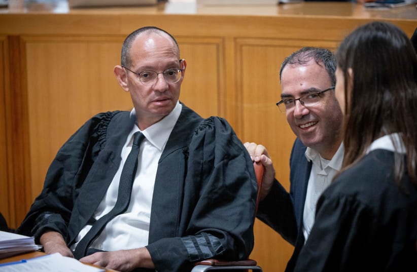  Attorney Aner Helman with Deputy Attorney General Gil Limon at a court hearing on petitions against the government's "Reasonableness Standard Bill", at the Supreme Court in Jerusalem. September 12, 2023. (photo credit: YONATAN SINDEL/FLASH90)